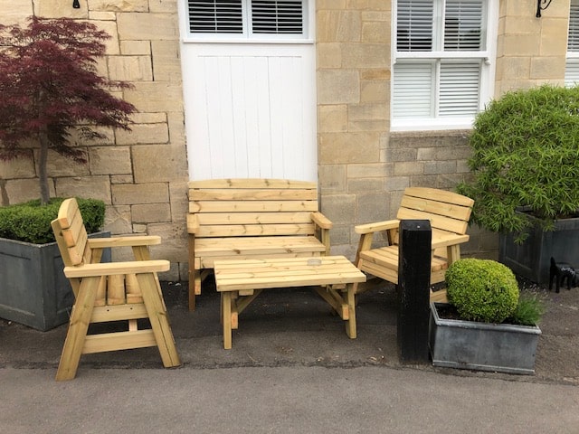 wooden garden coffee table with two seater wooden benches